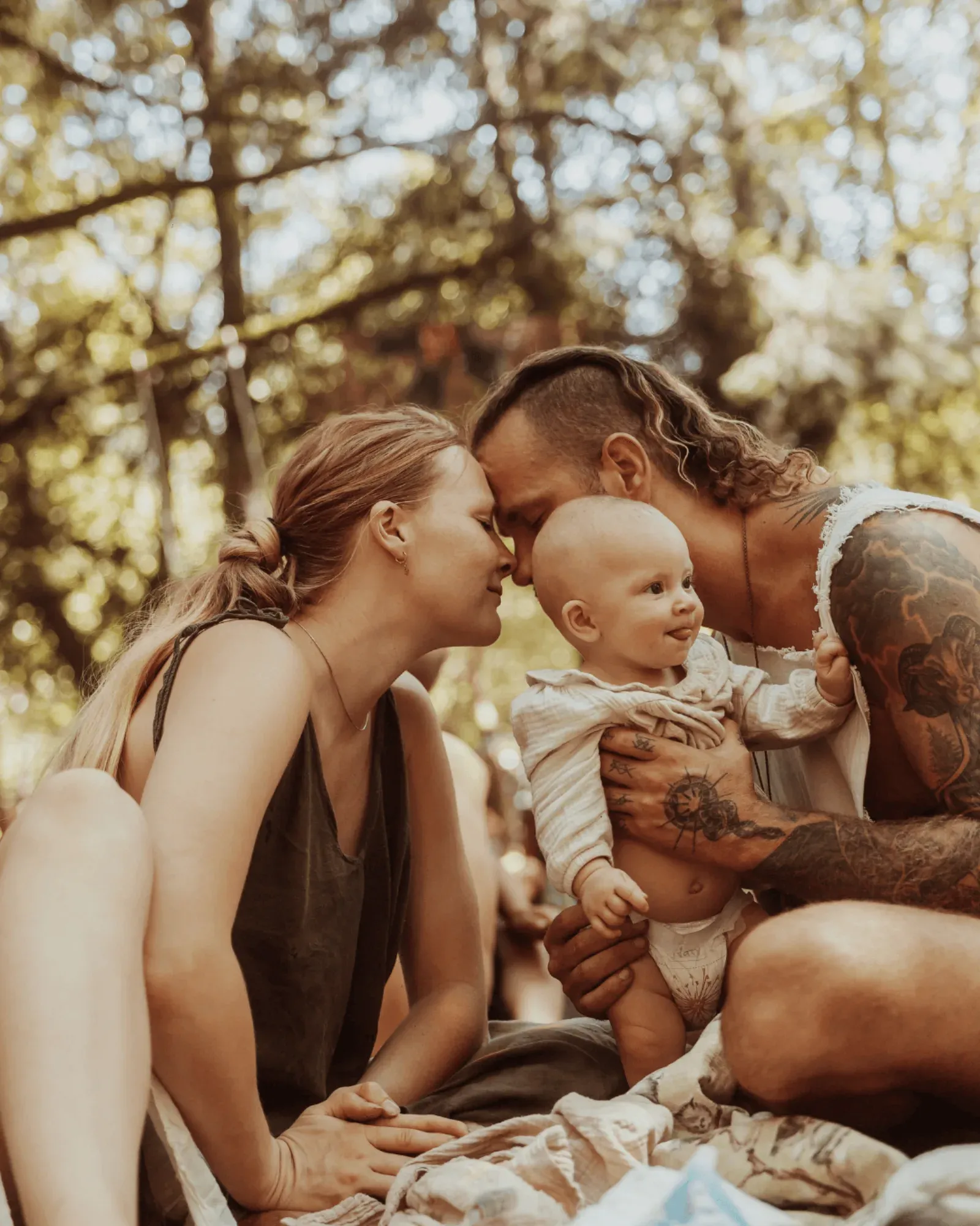 Parents laughing with their baby